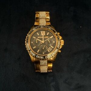 Michael Kors rose gold pave and crystal bezel watch.